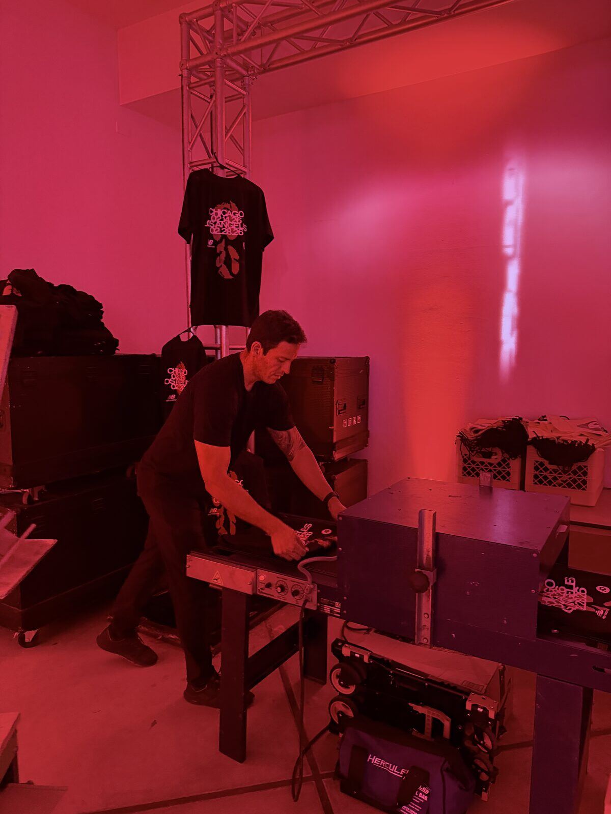 Heat press closing on a custom shirt at a live event bar